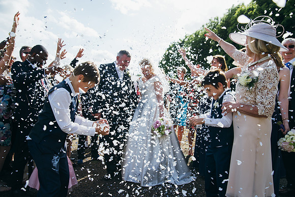 Wedding photographers in kent during a confetti shot in Canterbury