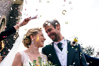 Bride and groom confetti shot during their wedding at Swarling manor, image by Nick Beal Kent wedding photographer
